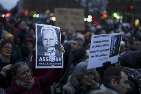 why is julian assange in custody